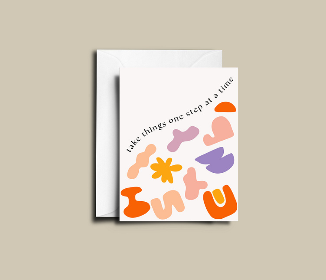 A greeting card with colorful abstract shapes and the words "Take things one step at a time".