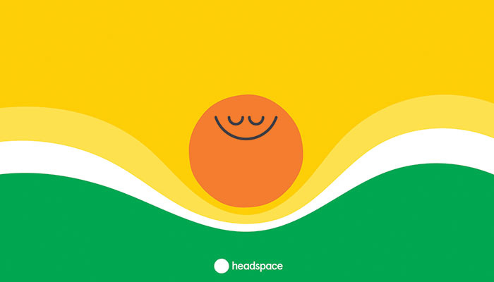 Headspace graphic with a smiling orange circle and flowing yellow and green waves.